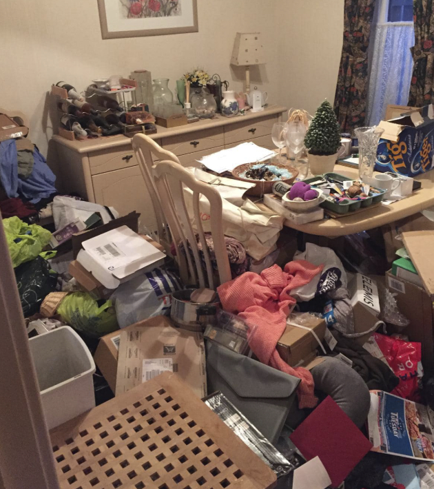 Cluttered dining room before hoarding clearance